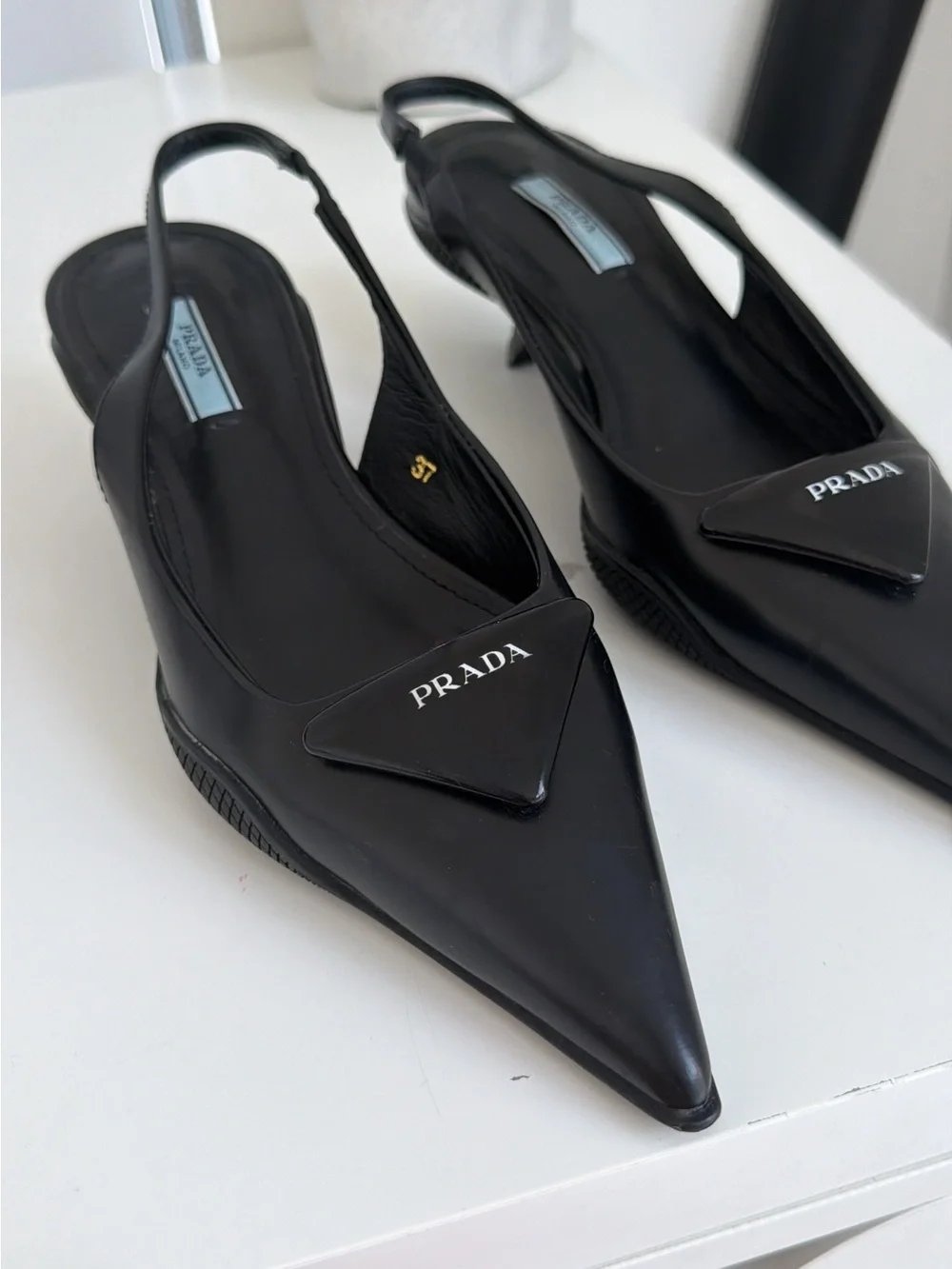 Prada Black Pointed Slingback Pumps with Logo Plaque